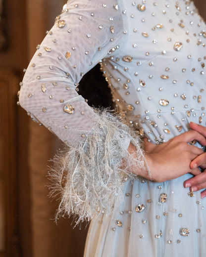 ‘EVELYN’ GREY HIGH NECK BALL GOWN WITH FEATHER CUFFS